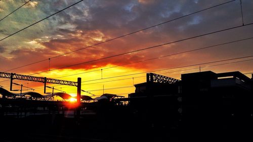 Silhouette of city at sunset