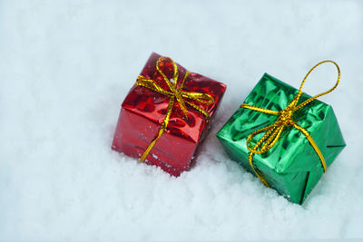 High angle view of christmas decorations on snow