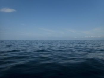 Scenic view of sea against blue sky