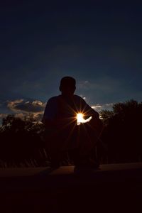 Silhouette of man at sunset