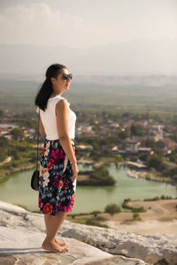 Young woman looking at cityscape