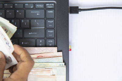 Directly above shot of person using laptop on table