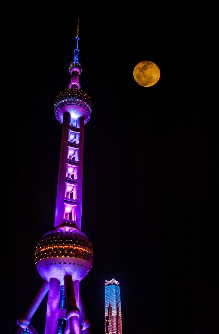 LOW ANGLE VIEW OF ILLUMINATED TOWER AGAINST SKY