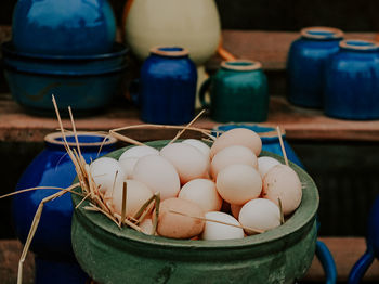 High angle view of eggs in basket on table