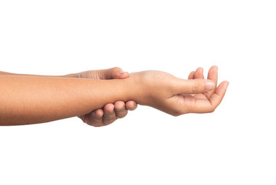 Close-up of hands over white background