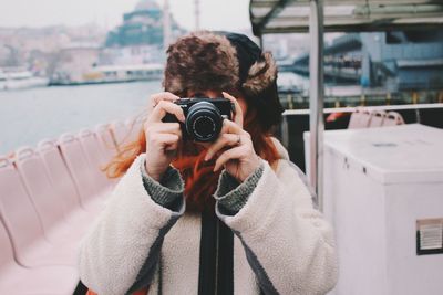 Woman photographing with camera