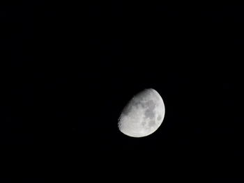 Low angle view of moon against sky at night