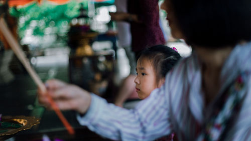 Girl looking away in temple