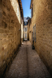 Narrow alley along buildings