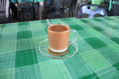 Close-up of coffee cup on table