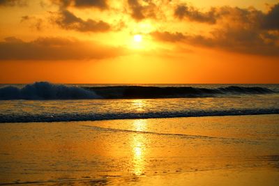 Scenic view of sea against romantic sky at sunset