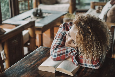 Mature woman sleeping at library