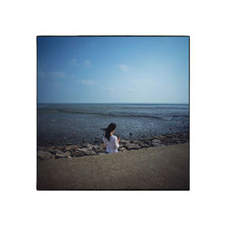 Rear view of man on beach