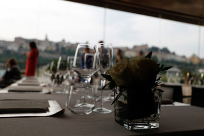 Drinking glass on table at cafe