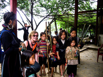 Portrait of smiling young couple standing outdoors