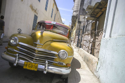 Vintage car parked against building