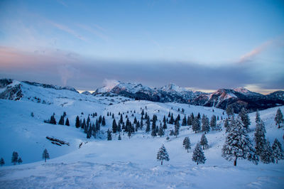 Scenic view of snow covered mountains against sky