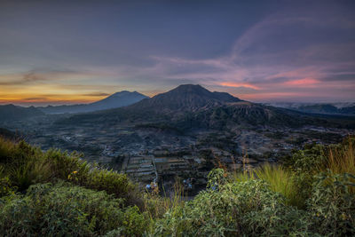 Scenic view of mountains against sky during sunset