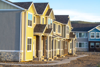 Residential buildings against sky in city