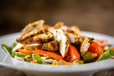 Close-up of salad served in plate on table