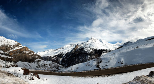 Scenic view of snowcapped mountains against sky