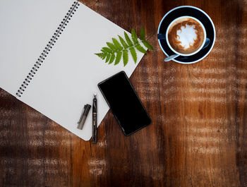 High angle view of coffee cup on table