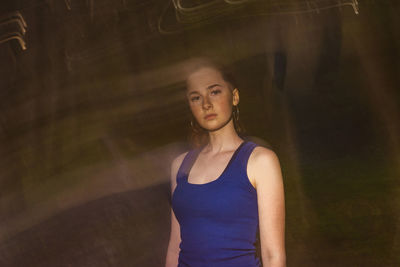 Portrait of teenage girl standing outdoors