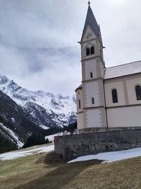 Building against sky during winter