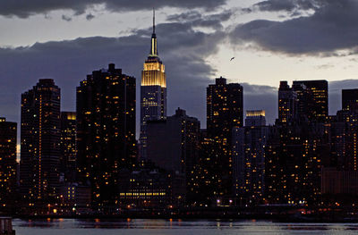 View of skyscrapers lit up at night