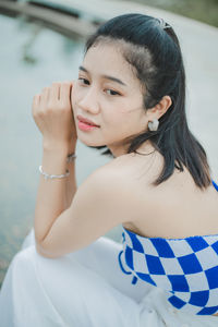 Close-up of young woman looking away