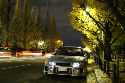 Cars on street in city at night