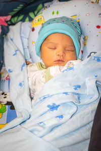 Newborn baby isolated sleeping in white cloth from different angle