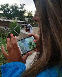 Close-up of woman using mobile phone