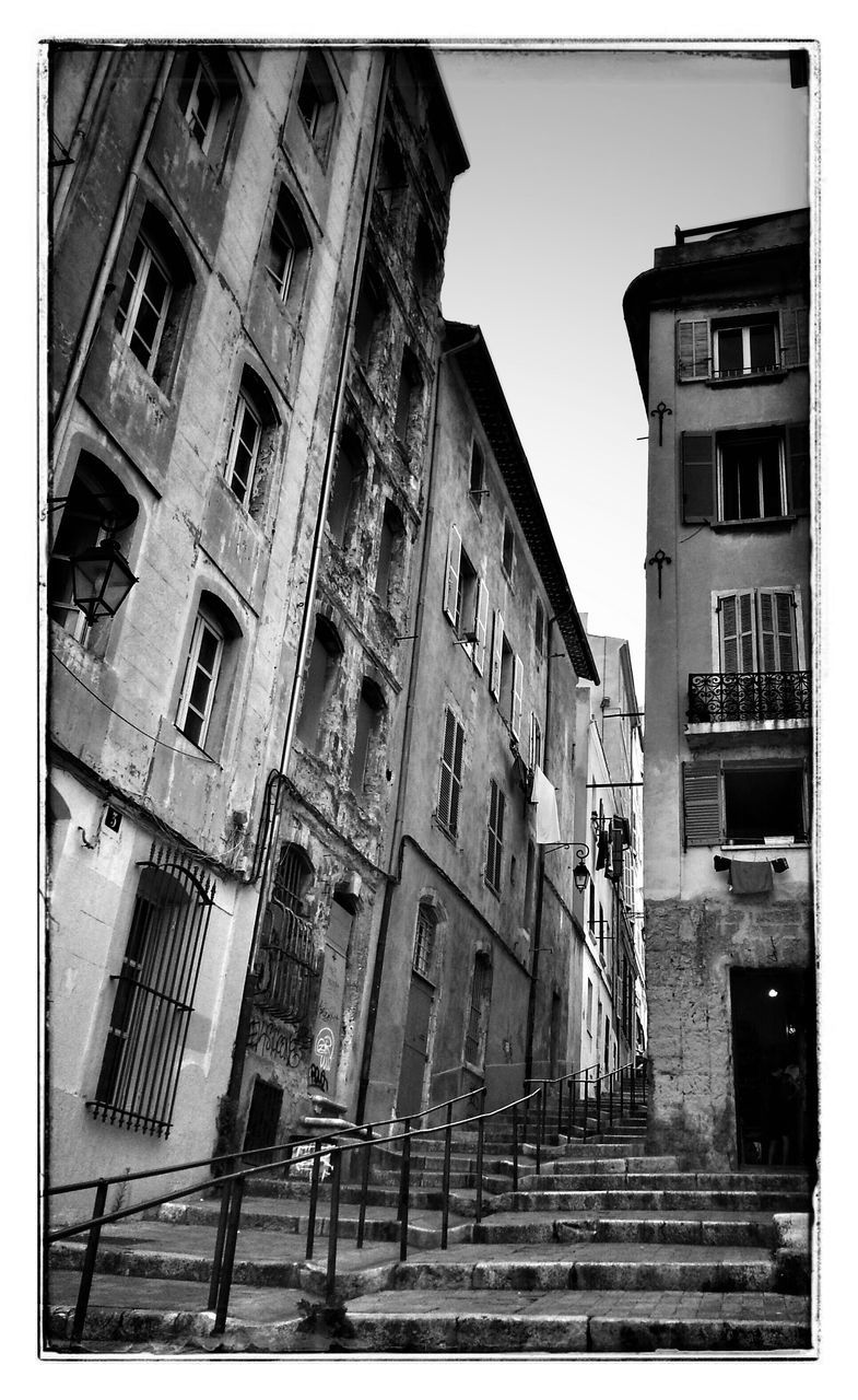 architecture, building exterior, transfer print, built structure, low angle view, auto post production filter, window, building, residential building, clear sky, city, residential structure, day, facade, outdoors, balcony, sky, no people, city life, exterior