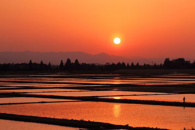 Scenic view of silhouette landscape against romantic sky at sunset