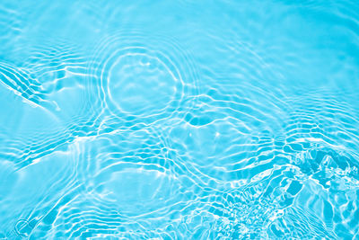 Blue transparent clear calm water surface texture