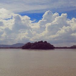 Scenic view of sea against cloudy sky