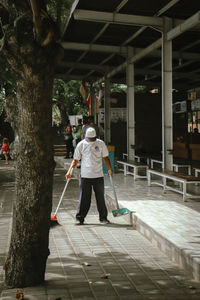 A man sweeping 