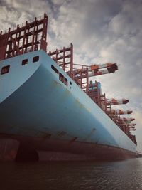 Low angle view of ship in sea against sky