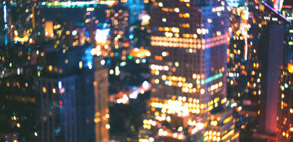 Defocused image of illuminated buildings at night