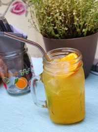 Close-up of drink in glass jar on table