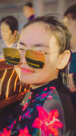 Close-up portrait of woman with sunglasses