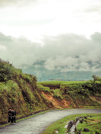 Scenic view of landscape against cloudy sky