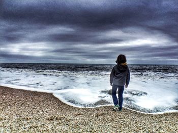 Scenic view of sea against cloudy sky