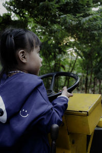 Girl sitting on tractor