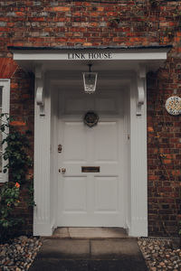 Front door with a metal door knocker of a traditional english house in rye, uk.