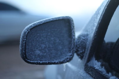 Close-up of car on side-view mirror