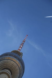 Low angle view of fernsehturm against blue sky