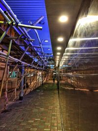 Man in illuminated underground walkway
