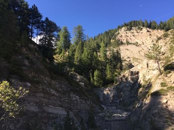 Scenic view of rocky mountains against clear sky